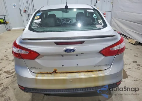 2013 Ford Focus Titanium z USA, uszkodzony, nr VIN 1FADP3J29DL358576